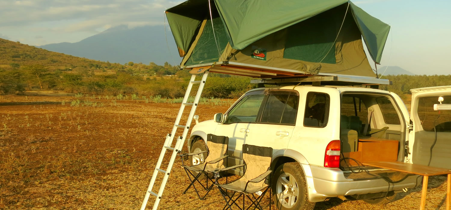 Car with roof top tent